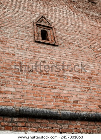 Loopholes of the old fortress. Royalty-Free Stock Photo #2457001063