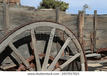 An old wooden western wagon for hauling goods in the 1800's.