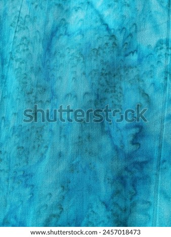 fabric background manually dyed turquoise blue