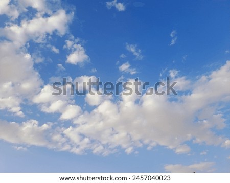 Beautiful Blue Sky Puffy White Clouds Stock Photo.This is very beautiful sky photography. It's amazing.It's bright sky