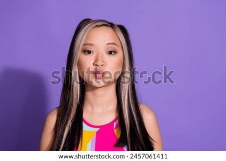 Photo of lovely charming nice girl wear stylish clothes send you kiss isolated on purple color background