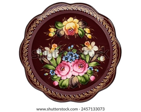 Empty Old Slavic folk handpainted metal tray with floral color pattern on white. Serving Plate with decorative border. Painted dish. Use for interior design. Top view. Royalty-Free Stock Photo #2457133073