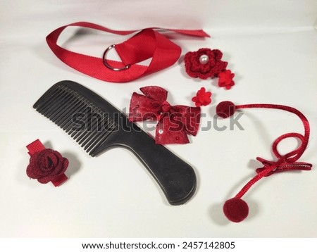 Various set of red color hair accessories isolated on white background
