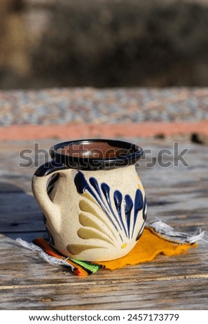 traditional mexican cup of coffee on wooden table Royalty-Free Stock Photo #2457173779