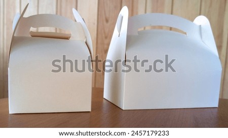 Takeaway two blank mock up cake carton Boxes tasty white box for mockup design empty brand text on wooden indoor Background