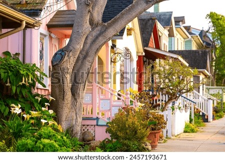 Colorful historic houses Pacific Grove, a picturesque village near Monterey, California). Charming wooden facades and well kept gardens in stylish vintage neighbourhood. Popular tourist destination Royalty-Free Stock Photo #2457193671