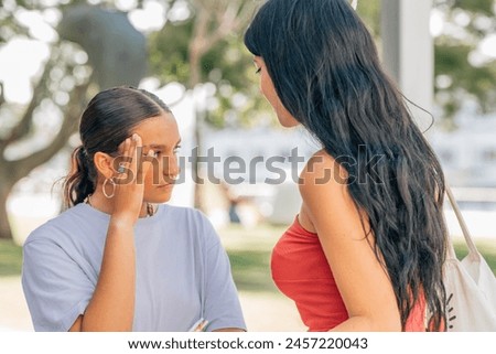 friends arguing or fighting outdoors Royalty-Free Stock Photo #2457220043
