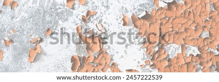 Brown peeling paint on the wall. Old concrete wall with cracked flaking paint. Weathered rough painted surface with patterns of cracks and peeling. High resolution texture for background and design.