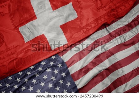waving colorful flag of united states of america and national flag of switzerland on the dollar money background. finance concept.