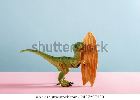 Happy dinosaur with surfboard on pink and blue background.