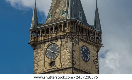 Old Town Hall tower of Prague timelapse hyperlapse with Astronomical Clock (Orloj) close up view, Czech Republic. Orloj was installed in 1410. Four figures flanking clock are set in motion at the hour