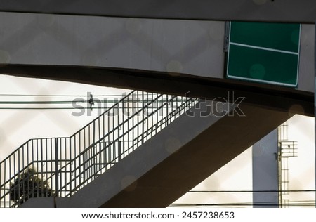 pedestrian walkway that goes over a highway and a sign with copy space mock up, in Brazil