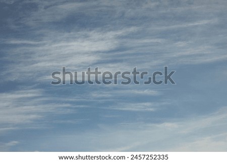 Clouds in the sky. Summer weather. Light clouds in blue sky. Atmospheric pressure. Royalty-Free Stock Photo #2457252335