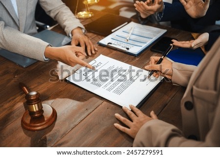 Business people and lawyers discussing contract papers sitting in the table at office in the morning. concepts of law, advice, legal services.