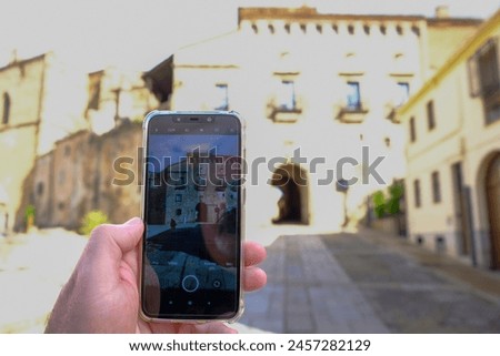 Person is taking photo with a smartphone.