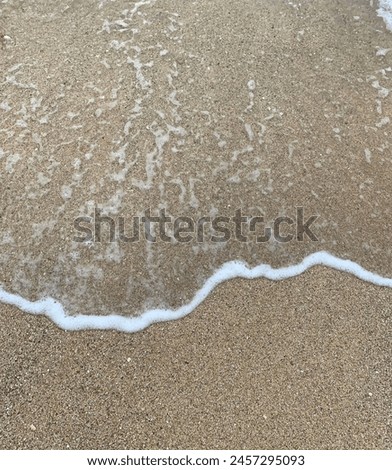 This is a beautiful wave on clean white sand