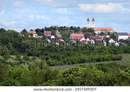 Village of Tihany and Saint Aignan abbey with fields and trees in the foreground Royalty-Free Stock Photo #2457349207