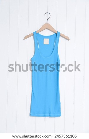 Blue vest isolated on white wooden  background. 

