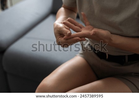 Hand Pain. Close-up of an office worker. Hands Hurt. Close-up Of Woman's Hands With Painful Feeling In Joint. Hand Injury And Health Issues Concept Royalty-Free Stock Photo #2457389595
