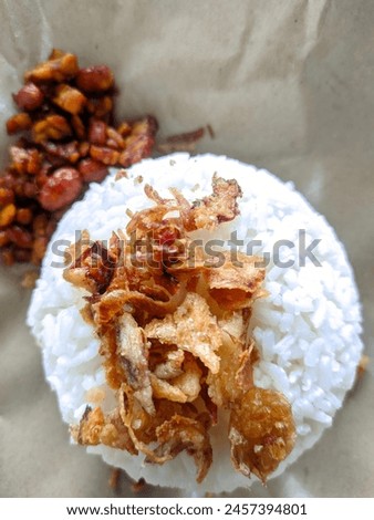 picture of a plate of rice with fried onions sprinkled on top