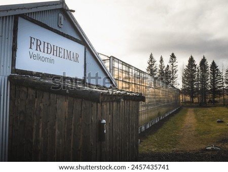 South Iceland-2nd march, 2023: welcome sign and tomato greenhouse building in Fridheimar - visitors friendly tomato farm.Famous travel destination on golden circle route