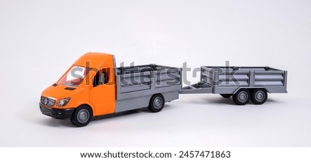 Toy plastic truck with trailer on a white background.