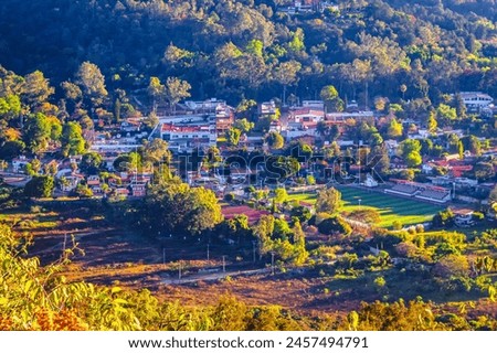 Village among the mountains seen from the heights, sunrise in the valley of Bravo state of Mexico