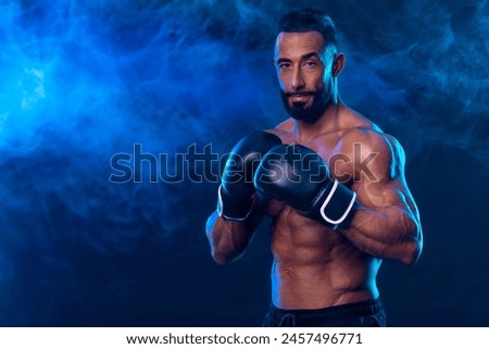 Boxer on the blue neon background. Download high resolution photo for advertising online sports betting. Picture for ads a bookmaker application.
