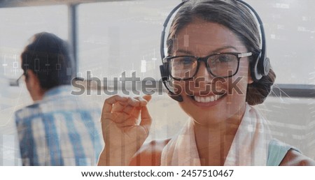 Image of financial graphs over happy caucasian female consultant in office. business, finance, connections, technology and digital interface digitally generated image.
