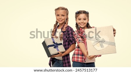 children girls sharing present. present to friend. present box from shopping. children girls with boxes. happy birthday. birthday present box. Girls showing off the box and its contents to others