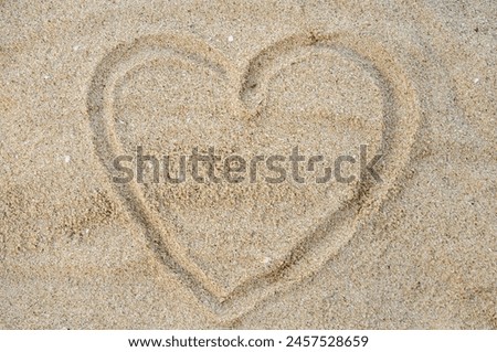 love picture on the beach sand made by visitors