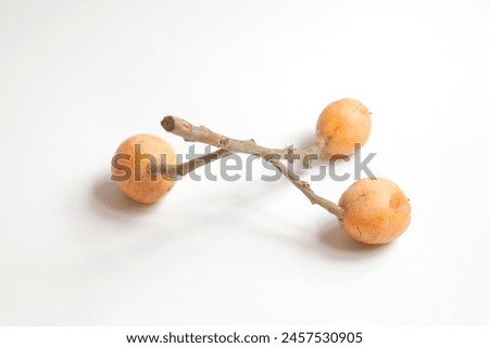 A cluster of loquat with leaves isolated on white background,closeup.