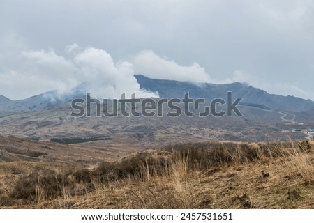 Mount Aso volcano eruption with heavy steam, Kumamoto, Kyushu, Japan. Here is the largest active volcano in Japan. Beautiful landscape and famous travel destination.
