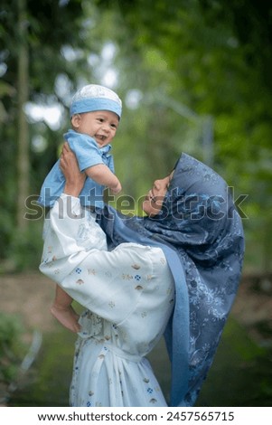 Beautiful young Asian mother bonding with Muslim son Health care and medical love asian woman lifestyle mother's day with anture background