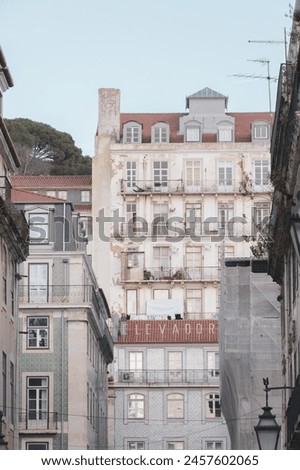 Ancient facade with the elevator sign to Saint George Castle at Lisbon, Portugal (Elevador do Castello in portuguese).