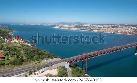 25th of April Suspension Bridge over the Tagus river, connecting Almada and Lisbon in Portugal aerial timelapse from above