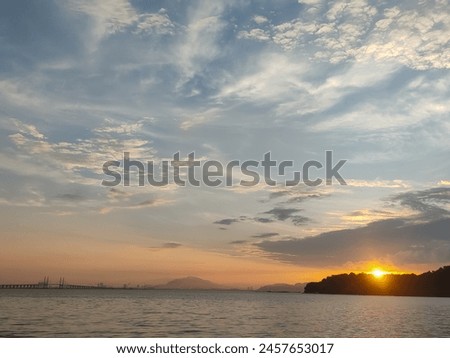 A picture of the sun setting in the evening sky. Background picture concept about the environment.