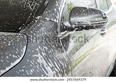 car cleaning and washing with foam soap