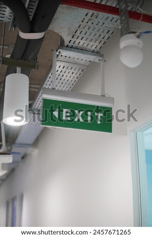 exit sign in hotel corridor
