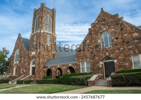 St. Luke's United Methodist Church, aka Brick Church in rare medieval Artisan Mannerism style with Romanesque, Gothic, and Jacobean influences in the historic downtown of Kilgore, Texas Royalty-Free Stock Photo #2457687677