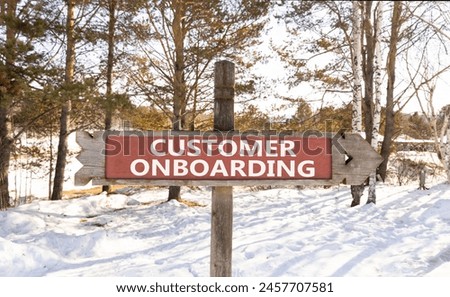 Customer onboarding symbol. Concept words Customer onboarding on beautiful wooden road sign. Beautiful forest snow blue sky background. Business Customer onboarding concept. Copy space.