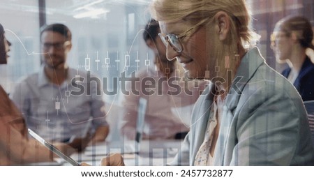Image of financial data processing over diverse group of business people. Global business, finance and connections concept digitally generated image.