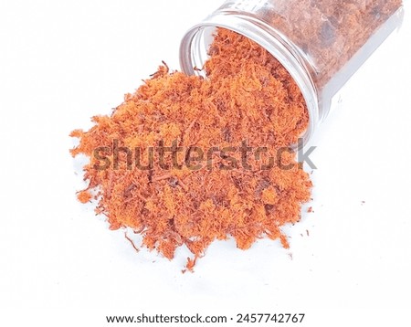 Meat floss, a dried meat product with a light and fluffy texture similar to coarse cotton, originating from China.  Royalty-Free Stock Photo #2457742767