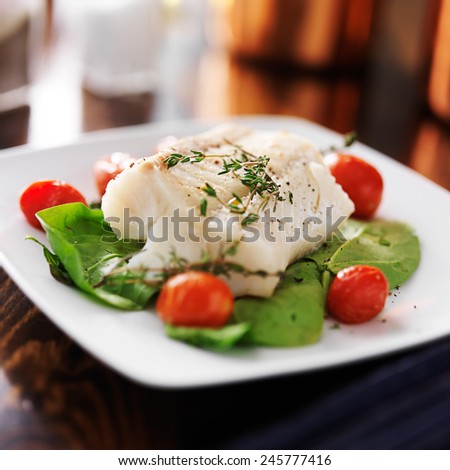 halibut with spinach, cherry tomatoes and thyme