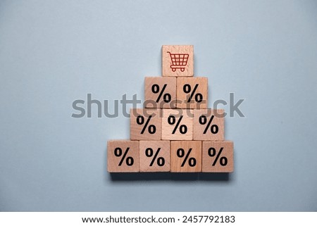 Interest rate financial and mortgage rates concept. Hand putting wood cube block increasing on top with icon percentage symbol upward direction