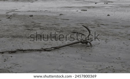An anchor is a device, normally made of metal, used to secure a vessel to the bed of a body of water to prevent the craft from drifting due to wind or current