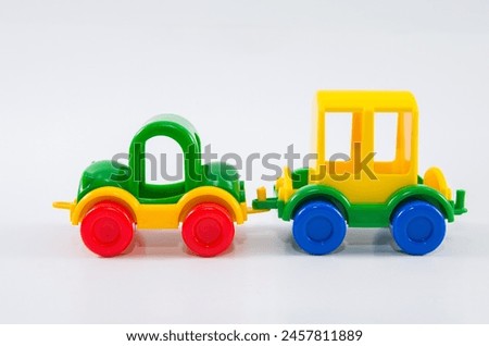 Plastic toy car with travel trailer.