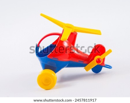Children's plastic helicopter on a white background.