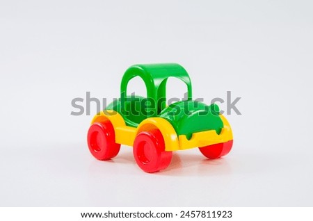 Plastic toy car on a white background.