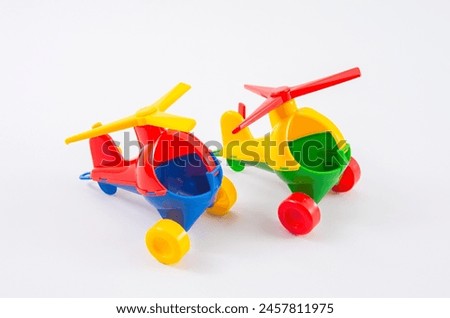 Children's plastic helicopter on a white background.